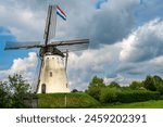 Historical white windmill De Volharding from 1891 in the village of Zeddam, Province Gelderland, The Netherlands