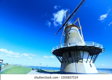 historical windmills at the coast of the city of vlissingen 