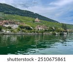 historical wine-grower village Ligerz and its vineyards on the slopes of the Jura mountain and coastline of Lake Biel, Switzerland