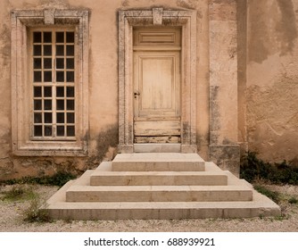 Historical Wooden Door with Symmetrical Stone Steps and Window of Same Size, The Chapel of la Vieille Charite, Marseille, France