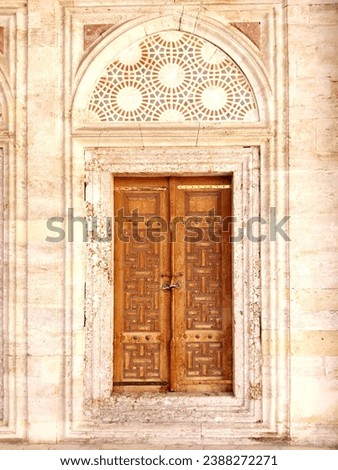 Historical wooden mosque madrasa door, decorated door insde a Mosque