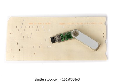 The History Of Computer Data Storage, Vintage 80 Column Computer Punch Card And A Modern USB Memory Key