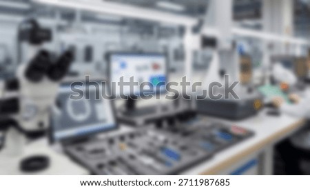 HiTech Lab Microscope with Computer, and Precision Tools Blurred background.