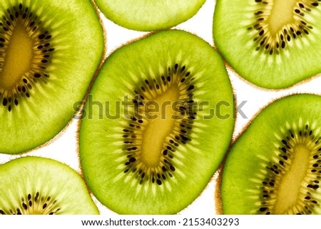 Hith angle of cut kiwis close up vibrant background