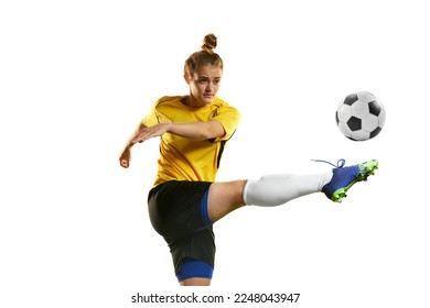Hitting ball with leg. Young professional female football player in motion, training, playing football, soccer isolated over white background. Concept of sport, action, motion, competition, hobby, ad. - Shutterstock ID 2248043947