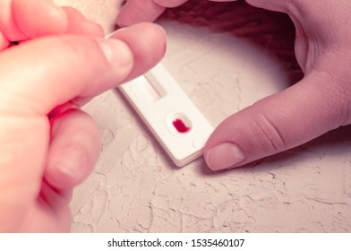 HIV Self-test Finger With A Drop Of Blood. Hiv Test Express. Self Human Immunodeficiency Virus Testing.