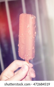 Hloding ice cream in the hand first person point of view at sunny day