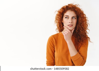 Hmm interesting. Curious cunning good-looking redhead girl planning perfect scheme, rub chin, squinting suspicious and thoughtful peek left, thinking, pondering between nice choices
