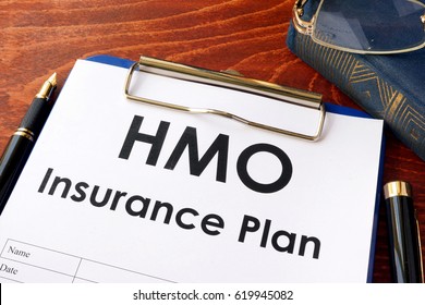 HMO Insurance Plan On A Table. (Health Maintenance Organization)