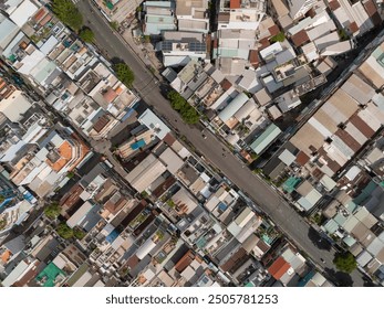 Ho Chi Min City, Vietnam District eight from top down aerial view featuring  rooftops, dense urban housing, streets and alleyways. - Powered by Shutterstock