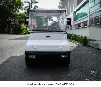 Ho Chi Minh City, 30 April 2021: Front View Of White Used Golf Cart On Street Side Walk In Urban Residential Area.