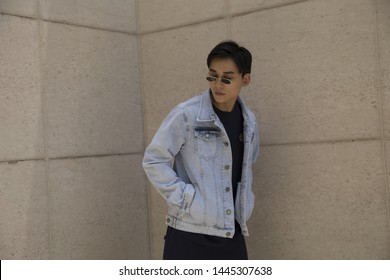 Ho Chi Minh city, Viet Nam - July 6, 2019 : Asian young man walking on the street, wearing glasses, wearing a jacket, fashion. - Shutterstock ID 1445307638