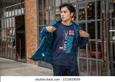 Ho Chi Minh City, Viet Nam - August 16, 2018 : Asian Man Walking In The Street, Fashion Style, Wearing Blouse, Fashion .