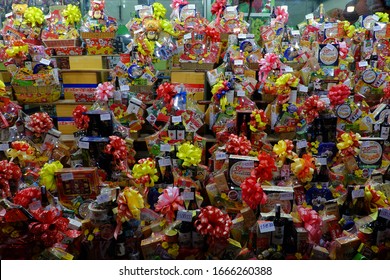 HO CHI MINH CITY, VIET NAM- JAN 17, 2020: Group gift box show at facade of food market to make present for Tet holiday, sweet food with cake, candy and wine pack in many price list to retail at market