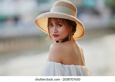 Ho Chi Minh city, Viet Nam: Portrait of a beautiful Vietnamese girl in the sunset 