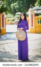 Ho Chi Minh city, Viet Nam: Vietnamese girl going to pagoda in ao dai