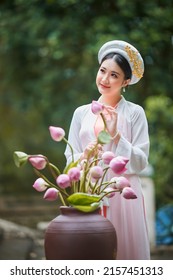 Ho Chi Minh City, Viet Nam: Vietnamese Girl Going To Pagoda In Ao Dai