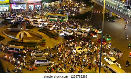 HO CHI MINH CITY, VIETNAM, MARCH 2017 – DRONE: Flying Above A Big Roundabout Getting Congested On A Busy Night In Ho Chi Minh. Cool Aerial Shot Of Chaotic Traffic In A Metropolitan City In Vietnam.