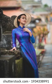 Ho Chi Minh City, Vietnam: Ho Chi Minh City, Vietnam: Portrait women in purple ao dai Vietnam, The Ao dai ( long-dress Vietnamese) is traditional costume of Vietnamese woman

