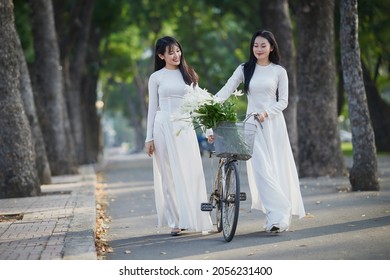 Ho Chi Minh City, Vietnam: The beautiful and pure friendship of two Vietnamese schoolgirls in white ao dai