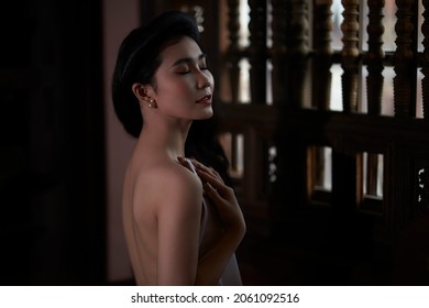 Ho Chi Minh City, Vietnam: Vietnamese girl shows off her sexy bare back in a traditional dress 