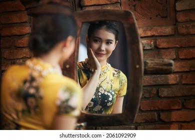 Ho Chi Minh City, Vietnam: Portrait of a beautiful Vietnamese girl in cheongsam 
