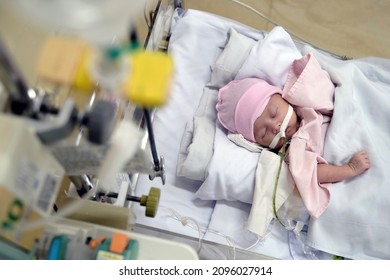 Ho Chi Minh City, Vietnam - Nov 22 2021: A Baby With Dehydration, Receiving Medication Through Intravenous Fluid Therapy While Asleep In Hospital Bed 