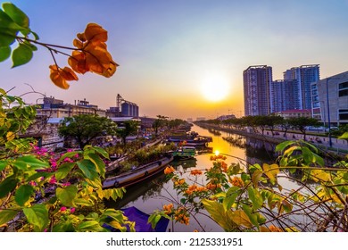 Ho Chi Minh city, Vietnam - 27 Jan 2022: Springtime in Saigon, boat on canal, transport spring flower for Tet to Ben Binh Dong open air market, Vietnamese happy with Lunar New Year, Vietnam. 