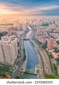 Ho Chi Minh City, Vietnam - 20 Aug 2022: Aerial Panoramic Cityscape View Of HoChiMinh City And The Nhieu Loc Canal , Vietnam With Blue Sky At Sunset.