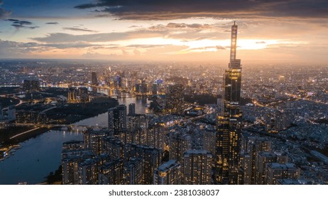 Ho Chi Minh city, Vietnam - 26 Oct 2023: Aerial view of Ho Chi Minh City skyline and skyscrapers on Saigon river, center of heart business at downtown, cityscape in the night