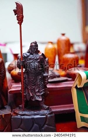 Ho Chi Minh City, Vietnam - December 25 2023: The wooden statue of Guan Yu, Guan Gong, Yun Chang, was a famous general during the late Eastern Han Dynasty and the Three Kingdoms period in China.