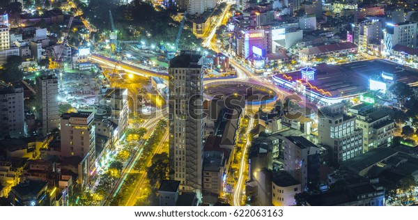 Ho\
Chi Minh City, Vietnam - April 11, 2017: Aerial night view of\
colorful and vibrant cityscape of downtown with traffic light\
trails Skyline by night in Ho Chi Minh city,\
Vietnam