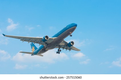HO CHI MINH, VIETNAM - FEB 9, 2015: An unidentified plane of the Vietnam airlines approaches the Tan Son Nhat Airport. Vietnam Airlines is the flag carrier of Vietnam.