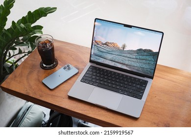 HO CHI MINH, VIETNAM, MAY 24 2022, MacBook Pro 14-inch, IPhone 13 Pro Max And Black Coffee With Ice