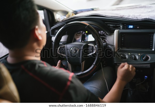 HO CHI MINH,\
VIETNAM - MAY 03, 2019: Interior of the Toyota vehicle that driven\
by the local grab driver.