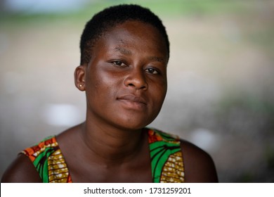 Ho, Volta / Ghana - September 14, 2018: A young woman looks into the camera for a portrait in Ghana, West Africa.