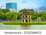 Hoan Kiem Lake ( Ho Guom) or Sword lake in the center of Hanoi in the morning. Hoan Kiem Lake is a famous tourist place in Hanoi. Travel and landscape concept. Selective focus.