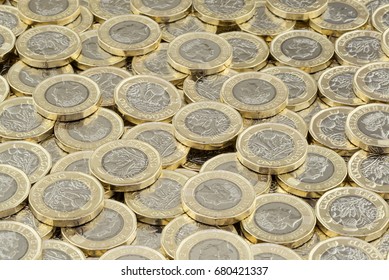 Hoard Of Money. Lots Of Coins Scattered In A Large Pile. New British Pound Coins Introduced In 2017