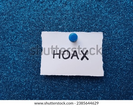 Hoax writing on a blue background.