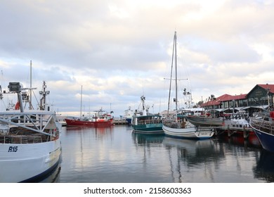 Hobart, Tasmania Australia - 17 May 2022 - fishing boats and yachts in Sullivan Cove on Salamanca Harbour Wharf in Tasmania