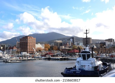Hobart, Tasmania Australia - 17 May 2022 - view of Hobart  city Sullivan Cove on Salamanca Harbour Wharf in Tasmania with historic buildings in background and mountain