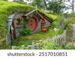 Hobbit house, round door under a green grassy hill