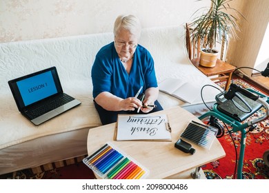 Hobby Ideas For Older People. Retirement Hobbies, Pastimes For Seniors. Activities For Seniors With Limited Mobility. Mature, Elderly Senior Female Artist Painting Picture, Practices Hand Lettering.