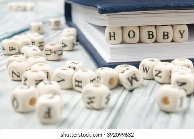 HOBBY word written on wood block. Wooden ABC - Shutterstock ID 392099632