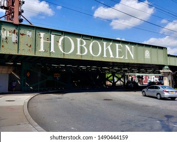 Hoboken, NJ - August 8 2019: A Hoboken Welcome Sign On The NJ Transit Rail Overpass Over Newark Street