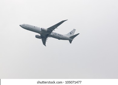 HOBOKEN, NJ - MAY 23: A Navy P-8A Poseidon Plane Flies Along The Hudson River Near Manhattan During The Parade Of Sails On May 23, 2012 In Hoboken, NJ. The Parade Marks The Beginning Of Fleet Week.