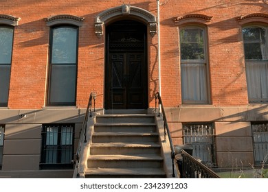 Hoboken, NJ, USA, brownstone entrance, facade of the building, staircase leading to the door - Powered by Shutterstock