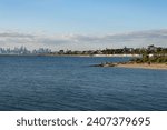 Hobson Bay skyline with colorful beach houses and Melbourne