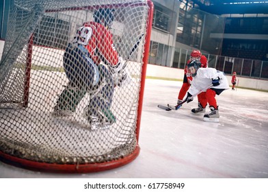 hockey goals, players shoot the puck and attacks goalkeeper