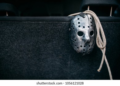 Hockey mask, rope, murderer concept